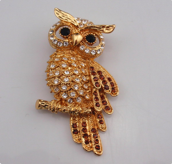 Metal owl brooch with rhinestones