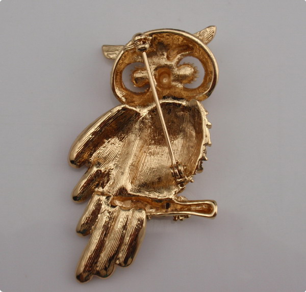 Metal owl brooch with rhinestones