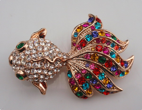 Fish shaped metal brooch